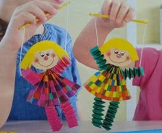 two children are playing with toys on the table