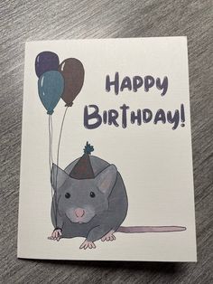 a card with a rat holding balloons and the words happy birthday written in black on it