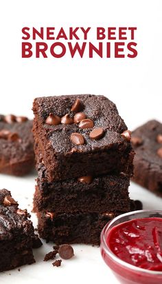 chocolate brownies stacked on top of each other next to a bowl of ketchup