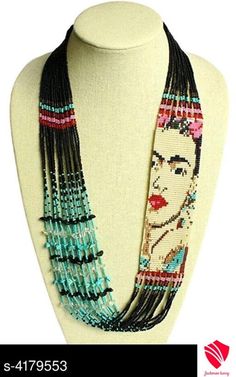 a beaded necklace on a mannequin head