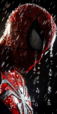 spider - man in the rain with drops of water on his face and head, looking down