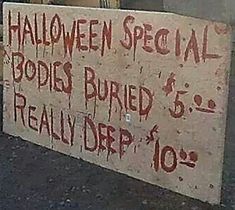 a sign that says halloween special podies buried $ 5, really drp $ 10