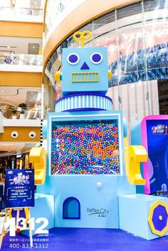 a robot made out of candy in a mall