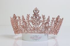 "FAST SHPPING Beautiful Zirconia crystal tiara in rose gold plated. Perfect for any occasion. It has a loop at the end of each side to attach it in your hair with bobby pins for added security. Approx. 3.5\" tall at its tallest point It comes with a beautiful, elegant box so you can keep it afterwards Style 5145RG Ready to ship in 2-3 business days." Rose Gold Quinceanera Tiara, Rose Gold Quince Dresses, Quinceanera Tiaras Rose Gold, Light Pink Quinceanera Crown, Rose Gold Quinceanera Decorations, Pink Crown Headpiece For Wedding, Rose Gold Quincea Crown, Pink Wedding Crown Headpiece, Rose Gold Tiara Crowns