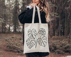 Monstera Tote Bag, Plant Lady Gift Shoulder Bags, Botanical Mama Totes, Cute Houseplant Print Shopping Bag,Funny Monstera Leaves Canvas Tote 👉 Product Details: The T-Shirts, V-Necks, youth and baby suits(onesie) are unisex.👈 👉Reading the Sizing Chart: Please note that the sizing chart includes the measurements of one side of the shirt, not the circumference. 👈 👉Please review all the sizing charts that were added in the product pictures.  👚 Women: Shirts will have a looser fit when choosing Tote Bag Painting, Bag Painting, Monstera Leaves, Plant Lady, Monstera Leaf, Product Pictures, Sizing Chart, Types Of Shirts, Positive Affirmations