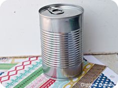 a can of soda sitting on top of a table