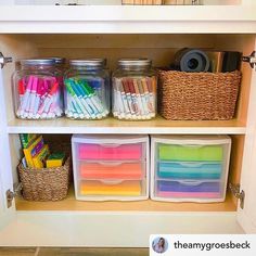 the shelves are filled with different types of pens and pencils in plastic bins