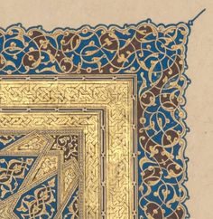 an intricate gold and blue design on paper