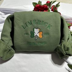 Stay warm and look stylish with this unique Limerick Ireland embroidered  at the center of the chest This piece of clothing is perfect for any casual occasion. The high-quality fabric keeps you warm and comfortable, while the intricate embroidery brings a touch of elegance and charm to any ensemble. Whether you're out and about or just lounging at home, this sweatshirt is sure to make you stand out from the crowd. The sweatshirt also features a classic crew neckline and long sleeves for a timele Winter Crew Neck Sweatshirt With Embroidered Patch, Winter Embroidered Patch Crew Neck Sweatshirt, Casual Sweatshirt With Embroidered Graphics As Gift, Casual Sweatshirt With Embroidered Text As Gift, Casual Sweatshirt With Embroidered Text For Gift, Casual Sweatshirt With Letter Embroidery As Gift, Fall Gift Sweatshirt With Embroidered Logo, Casual Sweatshirt With Embroidered Logo As Gift, Casual Embroidered Sweatshirt For Gift