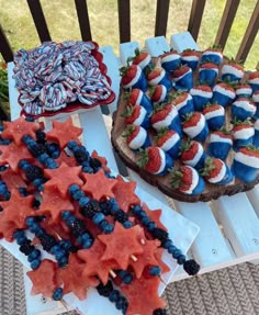 patriotic desserts are displayed on wooden trays