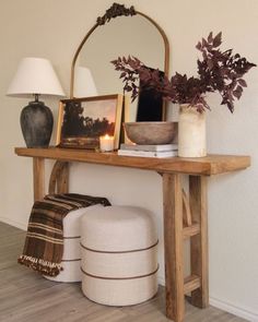 a wooden table with pictures on it and a lamp next to it that says instagram