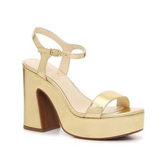 Jessica Simpson-Xilka Sandal Add a trendy touch to your formal wear with the Xilka sandals from Jessica Simpson. The chunky platform, slanted block heel, and double strap design upgrades a classic pump and will take your look to the next level. Jessica Simpson Now, Cheap Gold Heels With 4-inch Heel, High Heel Sandals With Gold-tone Hardware For Parties, Jessica Simpson Shoes 2022, Gold Synthetic Wedge Sandals With 4-inch Heel, Gold Synthetic Sandals With 4-inch Heel, Classic Pumps, Chunky Platform, Prom Shoes