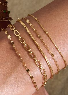 Everyone needs a simple chain that pairs well with every stack, and the Bennett bracelet is our go-to box chain. With a sleek shine that reflects from every angle, this piece is perfect for any minimalist who loves to stack. 14k Gold Fill Length: 6" + 1" ext Make your jewelry last! Click here for jewelry care. Need a gift box? We got you. Trendy Gold Bracelets With Box Chain, Minimalist Satellite Chain Bracelet As Gift, Minimalist Delicate Chain Bracelet For Layering, Dainty Stackable Bangle Chain Bracelet, Minimalist Satellite Chain Bracelet Gift, Trendy Everyday Round Chain Bracelet, Box Chain Bracelets With Rectangular Links, Everyday Gold-plated Cable Chain Bracelet, Minimalist Adjustable Chain Bracelets For Layering