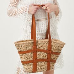 Kensie Straw Basket Shopper. Popular straw basket with criss-cross harness style faux leather straps details. A great new style basket bag for summer outings and more. Size:Top L47cm x Bottom L24cm x H27cm x W14cmThe handle height 34cm Gender: WOMENItem Type: Shoulder & HandbagsMain Material: StrawClosure Type: STRINGHardness: HARDLining Material: polyesterNumber of Handles/Straps: TwoInterior: No PocketDecoration: Criss-Cross Harness Style, Straw Beach Tote, Summer Brown, Straw Basket, Straw Tote Bag, Straw Handbags, Leather Patchwork, Rattan Bag, Khaki Fashion