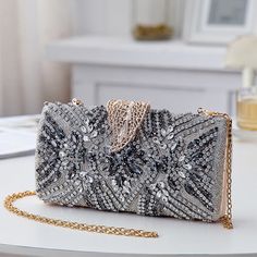 Add a touch of elegance to your evening party look with our exquisite Bridal Clutch Elegant Leaf Locker. This stunning clutch features a unique new design with intricate leaf patterns in a beautiful shade of blue, making it the perfect accessory for any bridal or special occasion outfit. Elegant Rectangular Sequin Clutch, Elegant Rectangular Evening Bag With Sequins, Elegant Sequined Evening Bag, Embellished Clutch For Wedding Guests, Elegant Clutch For Party Season, Elegant Sequined Clutch Evening Bag, Elegant Sequined Evening Clutch Bag, Elegant Sequined Evening Bag For Events, Elegant Silver Clutch For Wedding Guest