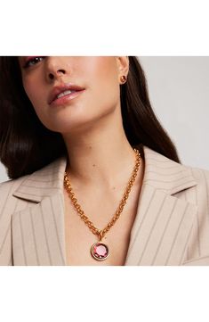 A stunning lab-created pink tourmaline anchors this statement pendant necklace suspended on a gleaming chain plated in 22-karat gold. 21 1/2" length; 1"W x 1 1/2"L pendant 22k-gold plate/lab-created pink tourmaline Imported Statement Pendant, Gold Pendant Necklace, 22k Gold, Pink Tourmaline, Anchors, Pink Gold, Gold Finish, Dean, Pink And Gold