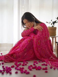 Step into the world of timeless elegance with our exquisite pink chiffon saree, adorned with intricate bandhani print work. This beautifully crafted saree captures the essence of traditional Indian art while embracing contemporary fashion trends. The delicate bandhani print work spread across the lightweight chiffon fabric creates a mesmerizing visual appeal, making it a perfect choice for festive celebrations and special occasions.
Complementing the saree is a matching pink chiffon blouse, also Unstitched Blouse Kurta For Navratri In Georgette, Transitional Pink Georgette Anarkali Set, Bohemian Pink Sharara With Sheer Dupatta, Pink Anarkali Kurta With Unstitched Blouse, Pink Bohemian Set With Sheer Dupatta, Pink Bohemian Kurta With Traditional Drape, Semi-stitched Bandhani Print Georgette Sharara, Navratri Bandhani Print Georgette Sharara, Transitional Pink Saree With Mirror Work