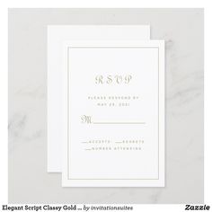 a white wedding card with gold foil on the front and bottom, featuring an elegant monogram