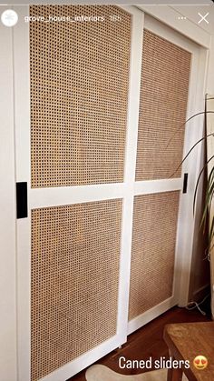 an image of a room divider made out of wickers and white doors