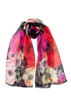 Named after the famous piazza in Rome, Campo de' Fiori (field of flowers), this sheer silk Georgette long scarf has a floral print. 100% Made in Como, Italy. Figure flattering size: Approx. 20” x 67". Years of trial and error taught us that this size scarf is one of the simplest to style and makes every woman look chic. 100% Silk Georgette: A lightweight, sheer crepe-style fabric characterized by its crinkly, pebbly texture and excellent drape that is often used in high-end fashion. It has a dul Silk Scarves With Floral Print For Spring, Black Silk Scarves With Floral Print, Black Silk Scarf With Floral Print, Red Floral Print Silk Scarf For Spring, Spring Flower Silk Scarf, Italian Silk Scarf, Silk Fashion, Long Silk Scarf, Field Of Flowers