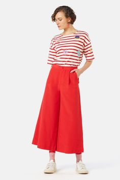 Our Chilli Culotte is designed to be a bright and bold closet essential with its vivacious red colour! Fitted comfortably at the high waist, this culotte is perfect for tucking a top into - complete with front slant pockets for ease of wear when you’re on the go! - Cotton and viscose blend fabrication - Full waistband - Button fly front, pleats and slant pockets - Back dart shaping - Standard fit - Cropped length, wide leg Style note: Style this culotte with our ‘Voulez Vous Oui Non Tee’ for a c Red Wide Leg Pants With Pockets, Red Summer Pants With Pockets, Red High Waist Wide Leg Summer Pants, Casual Red Wide Leg Summer Pants, Red Bottoms With Side Pockets And Relaxed Fit, Red Cotton Wide Leg Pants With Relaxed Fit, Chic Red Bottoms For Spring, Red Cotton Relaxed Fit Wide Leg Pants, Chic Red Spring Bottoms