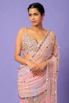 Editor's Note Featuring a blush pink pre-stitched saree in tulle base with gold reflective acrylics, glass cut beads, and sequins embellishments. It is paired with an embellished bralette.Please note - the set doesn't include a stitched petticoat . Color: Pink Fabric: Tulle Sleeve type: Sleeveless Component: Sari and blouse Occasion: Cocktail Care: Dry clean only Disclaimer: product color may slightly vary due to photographic lighting sources or your monitor setting. Note: this product is exclus Stitched Saree, Personal Shopping Service, Tulle Sleeves, Pernia Pop Up Shop, It Girl, See Me, Pink Fabric, Sarees Online, Personal Stylist