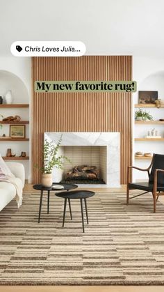 a living room with a fire place and two chairs in front of the fireplace that reads, my new favorite rug