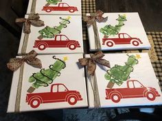 four christmas cards with red trucks and green trees on them, tied in twine