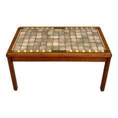 a wooden table with a tile top on it's legs and one leg is bent to the side