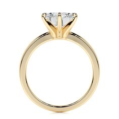 a yellow gold engagement ring with two princess cut diamonds