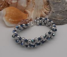 This beautiful bracelet is made with 6 mm Swarovski beads and 4 mm crystal bicono Swarovski crystal beads and other color with aurora borealis AB finish. The closure is 925 silver. The color of the pearls and crystals are at your choice. We propose the 3 combinations visible in the photos, but it is possible to indicate the preferred color for both pearls and crystals. If you have any doubts, I suggest you contact me that I can help you by proposing photographs of different combinations in the t Swarovski Beads, Swarovski Crystal Beads, Fine Jewels, Jewelry Diy, Cool Suits, Aurora Borealis, Beautiful Bracelet, Swarovski Crystal, Crystal Beads