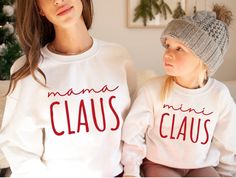 Mama Claus Mini Claus Sweatshirt| Family Claus Sweatshirt| Matching Family Christmas Sweatshirts| Mom Christmas Sweatshirts Ideal for any situation, a unisex heavy blend crewneck sweatshirt is pure comfort. These garments are made from polyester and cotton. This combination helps designs come out looking fresh and beautiful. The collar is ribbed knit, so it retains its shape even after washing. There are no itchy side seams on these sweaters.  .: 50% Cotton 50% Polyester .: Medium-heavy fabric (8.0 oz/yd² (271.25 g/m .: Loose fit .: Sewn in label .: Runs true to size Mom And Mini Outfits, Mama And Mini Sweatshirts, Thrift Inspiration, Stitched Shirts, Mini Outfits, Cricket Machine, Boys Wardrobe, Mini Outfit, Mama And Mini