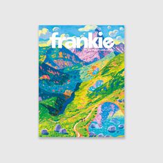 the front cover of frankie magazine with mountains and blue sky in the back ground