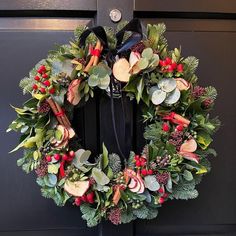 a wreath is hanging on the front door