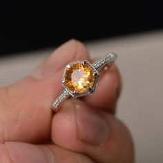 Hey, I found this really awesome Etsy listing at https://www.etsy.com/listing/531578577/yellow-citrine-ring-round-cut-engagement Citrine Birthstone Jewelry In Round Cut, Citrine Birthstone Jewelry Round Cut, Elegant Orange Sapphire Round Ring, Citrine Topaz Promise Ring, Classic Round Topaz Birthstone Ring, Orange Round Yellow Sapphire Jewelry, Elegant Amber Crystal Ring, Round Cut Citrine Gemstone Jewelry, Elegant Citrine Topaz Ring With Halo Setting