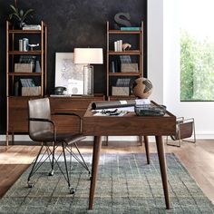 an office with a desk, chair and bookcase