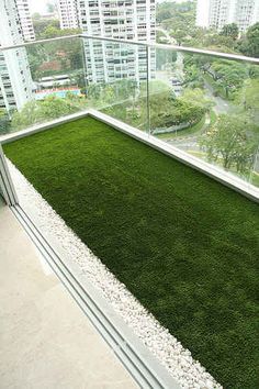 an artificial grass roof in the middle of a building