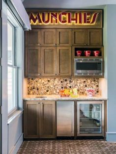 a kitchen with wooden cabinets and stainless steel appliances