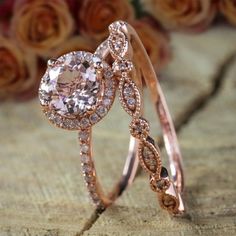 two rose gold wedding rings with diamonds on the top and one diamond in the middle