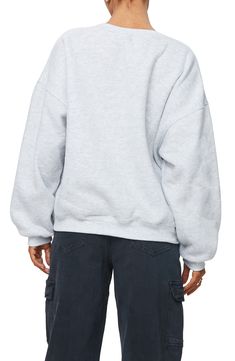 This cozy cotton-kissed sweatshirt is designed in a slouchy silhouette with dropped shoulders. Crewneck Dropped shoulders Ribbed cuffs and hem 65% polyester, 35% cotton Machine wash, dry flat Imported Oversized Sweatshirt With Elastic Cuffs For Streetwear, Gray French Terry Tops With Ribbed Cuffs, Cozy Fit Heather Grey Sweatshirt With Ribbed Cuffs, Relaxed Fit Sweatshirt With Ribbed Collar And Drop Shoulder, Heather Grey Long Sleeve Trendy Sweatshirt, Oversized Crew Top For Fall, Trendy Heather Grey Long Sleeve Sweatshirt, Oversized Heather Grey Sweater With Ribbed Cuffs, Gray Oversized Sweats