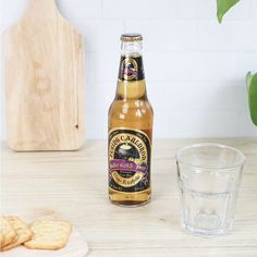 a bottle of beer and some cookies on a table