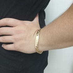 "Fashionable gourmet man's 18K Gold Plated bracelet with personalized name plate. Measurements and weight: 1cm / 0.4 width Name plate bar for engraving 4.2cm / 1.65\" length 25-28.3 gram weight (depend on size) Size options: 19.5cm = 7.7inch 21cm = 8.25inch 22.5cm = 8.85inch Warranty: One year from the day of purchase. The Warranty is for: Plating of gold and zircon/crystal stones setting in the jewelry. As part the warranties the jewelry will repaired and renew but not replaced or refunded. The Cuban Link Chain Bracelet Engraved Gift, Engraved Cuban Link Bracelets As Gift, Modern Customizable Gold Bracelets, Modern Customizable Gold Bracelet, Classic Cuban Link Bangle Bracelet, Classic Stainless Steel Cuban Link Bracelet As A Gift, Classic Stainless Steel Cuban Link Bracelet As Gift, Classic Stainless Steel Cuban Link Bracelet Gift, Modern Gold Name Bracelet For Personalized Gift