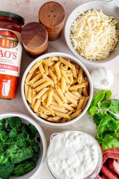 the ingredients for this pasta dish are neatly arranged in bowls