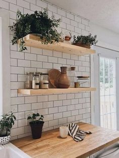 the kitchen is clean and ready to be used as a place for potted plants