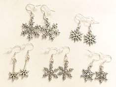 5 Different Unique Snowflake Sets of Earrings Each Set of Earrings is Gift Packaged with a Lacey Pouch and Earring Card Each Set of Snowflake Earrings comes with rubber backs Each set of Snowflake Earrings has Sterling Silver Hooks Free Shipping 3-5 business days with USA HANDEMADE IN USA Satisfaction Guaranteed! Gemini Jewelry, Teacher Shoes, Winter Jewelry, Earring Card, Snowflake Earrings, Holiday Gift Sets, Earring Collection, Earring Cards, Holiday Jewelry