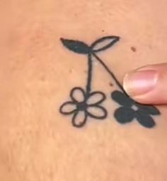 a woman's stomach with a flower drawn on it and the word love written in cursive writing