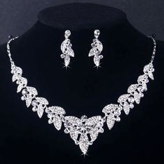 Sparkle and shine as you walk down the aisle! This beautiful three-piece bridal jewelry set is adorned with intricately faceted rhinestone crystals that capture the light from every angle with a perfectly translucent appeal. All pieces are rhodium plated for a flawless finish which enhances the intricate detailing and conveys a modern take on old elegance. Necklace: 17" (approx. 43cm) long with a 2" (approx. 5cm) extension chain for comfortable sizing. Earrings: 1.25" (approx. 3.2cm) and come wi Wedding Dubai, Wedding Jewelry And Accessories, Opal Jewelry Set, Crystal Bridal Jewelry Sets, Crystal Wedding Jewelry, Bridal Jewelry Set, Rhinestone Crown, Wedding Accessories Jewelry, Silver Accessories