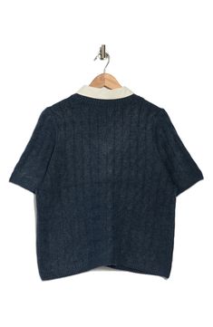 This cable-stitched sweater is contrasted by a woven collar in this twofer top that elevates in-office or off-duty looks. 19 1/2" length Point collar Short sleeves 73% acrylic, 24% polyester, 3% spandex Machine wash, tumble dry Imported Blue Sweater With Ribbed Collar For Work, Blue Collared Polo Sweater For Workwear, Collared Textured Knit Sweater For Work, Casual Collared Cable Knit Sweater, Blue Polo Sweater With Ribbed Collar For Work, Knit Polo Sweater For Work, Workwear Sweater With Ribbed Collar, Fall Workwear Cable Knit Tops, Casual Collared Cable Knit Top