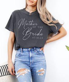 a woman wearing a mother of the bride t - shirt with ripped jeans and heels