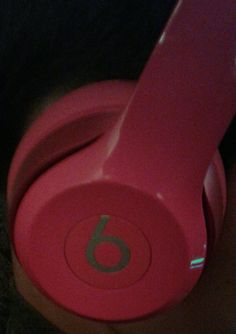 the headphones are pink and have numbers on them